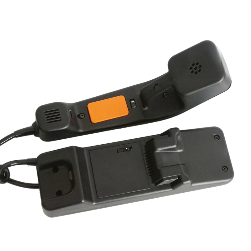 Halterung liegt neben Handapparat, dieser liegt auf dem Rücken, innen eine orangene quadratische Push-Taste